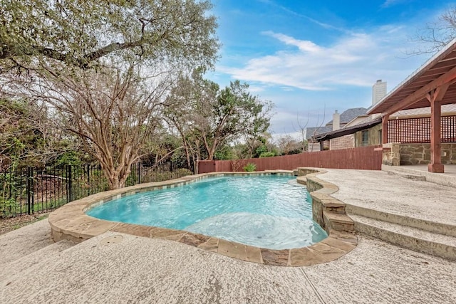 view of swimming pool with a patio