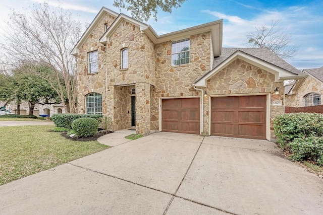 view of front of house with a garage and a front lawn