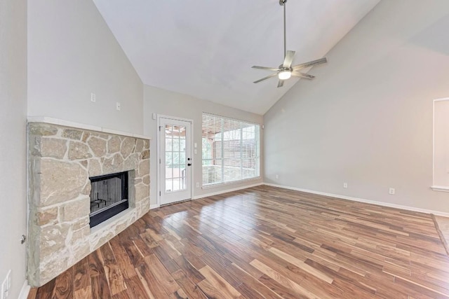 unfurnished living room featuring ceiling fan, a fireplace, high vaulted ceiling, and hardwood / wood-style flooring