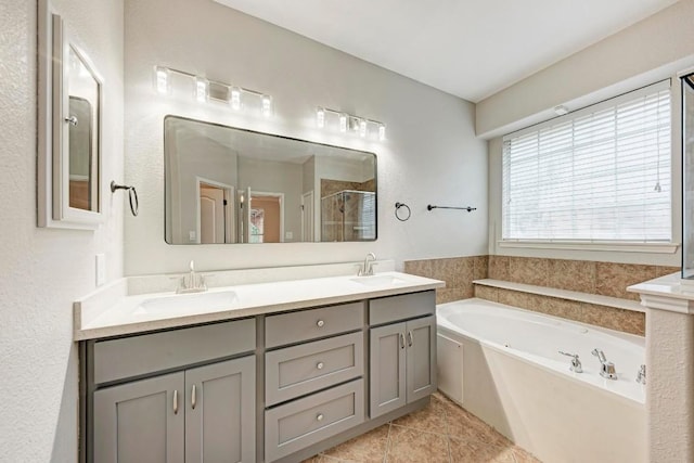 bathroom featuring tile patterned flooring, vanity, and independent shower and bath