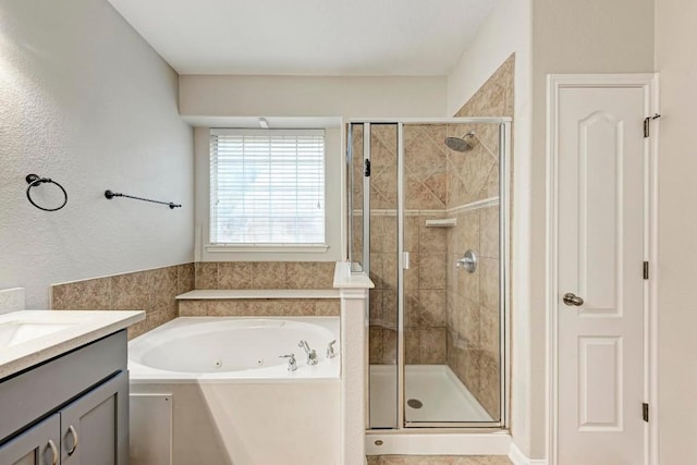 bathroom featuring plus walk in shower and vanity