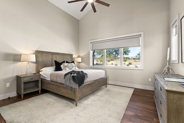 bedroom featuring hardwood / wood-style flooring, high vaulted ceiling, and ceiling fan