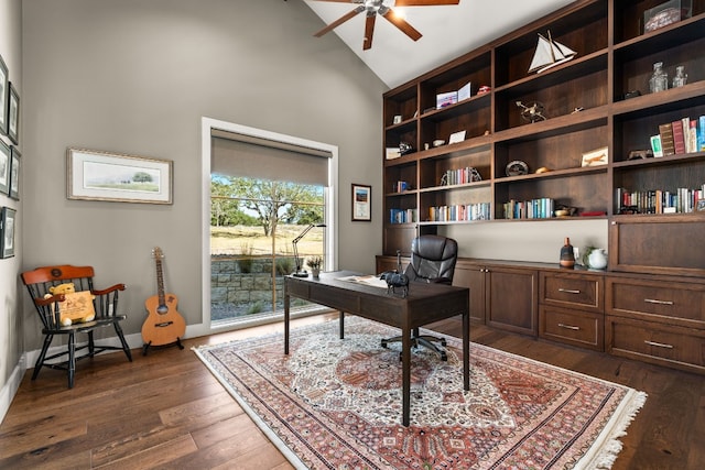 home office featuring ceiling fan, dark hardwood / wood-style flooring, and vaulted ceiling