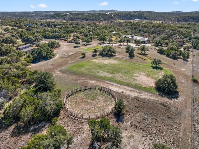 birds eye view of property with a rural view