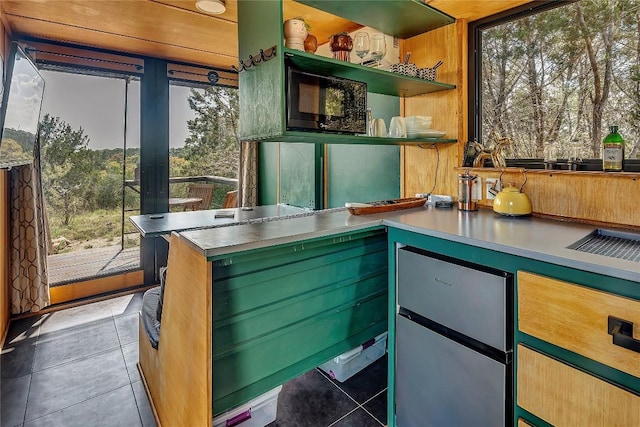 kitchen with light tile patterned floors