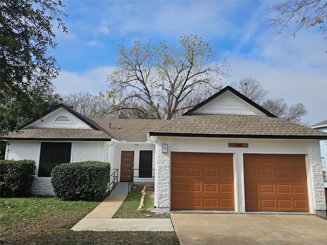 single story home with a garage, stone siding, roof with shingles, and driveway