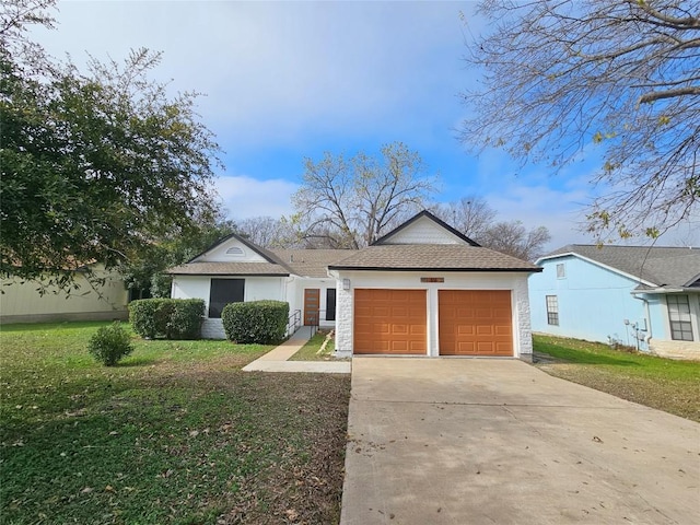 ranch-style home with a front yard and an outbuilding