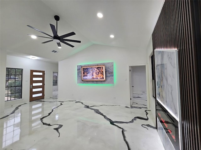 interior space with ceiling fan and vaulted ceiling