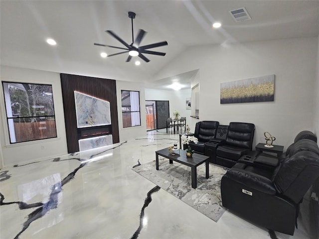 living area with visible vents, vaulted ceiling, concrete floors, a fireplace, and recessed lighting