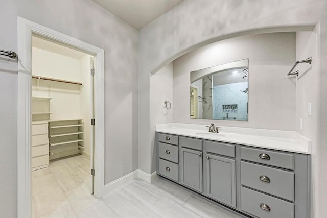 bathroom with vanity and walk in shower