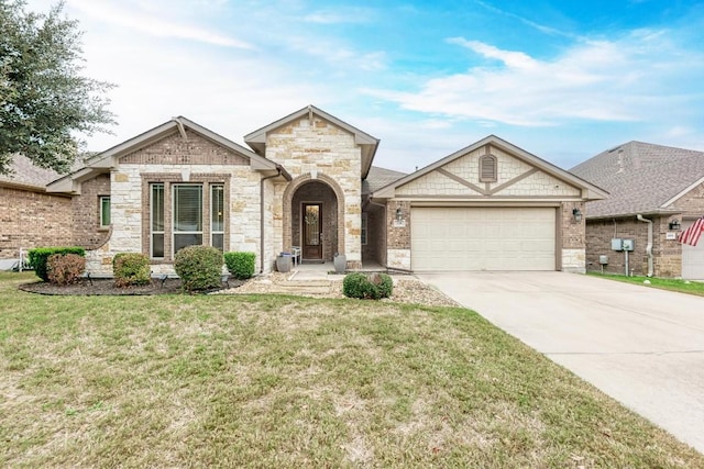 view of front of house with a front yard and a garage