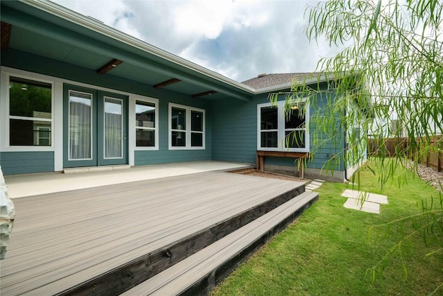 wooden terrace with a yard