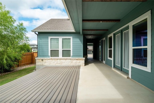 wooden terrace with a patio