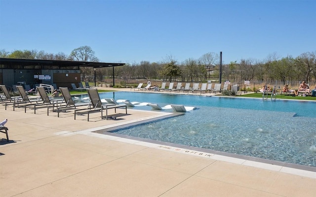 view of swimming pool featuring a patio area