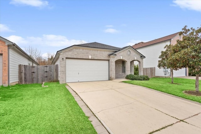 view of front facade featuring a front yard and a garage