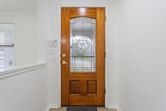 interior space with light tile patterned floors