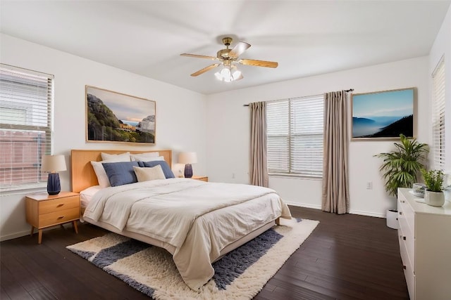 bedroom featuring ceiling fan and dark wood-type flooring