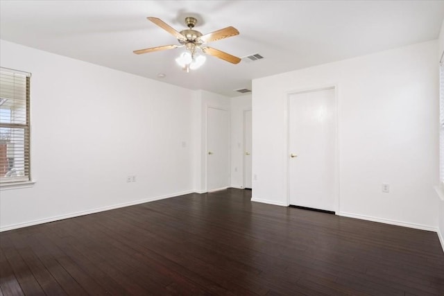 unfurnished bedroom with ceiling fan and dark hardwood / wood-style floors