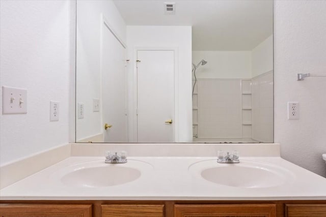 bathroom featuring vanity and walk in shower