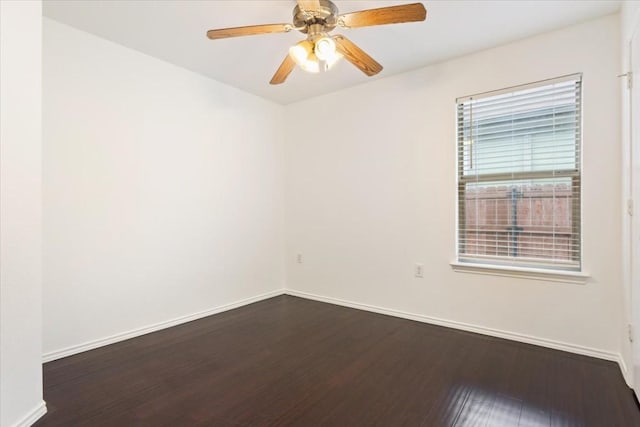 unfurnished room with ceiling fan and dark wood-type flooring