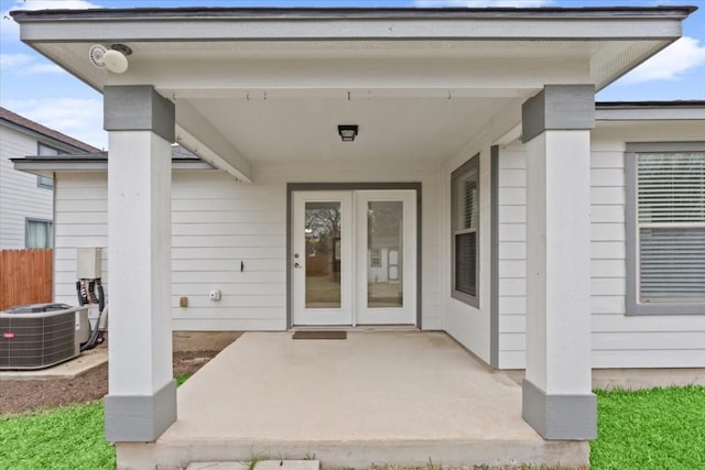 property entrance with central AC and a patio area