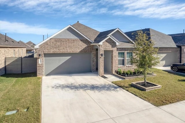 view of front of house with a front lawn and a garage