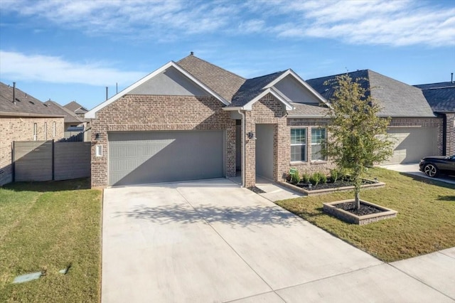 view of front of house featuring a garage and a front yard