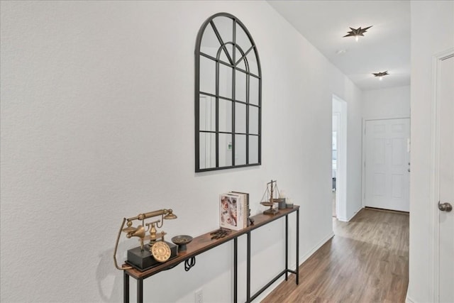 entryway featuring wood finished floors and baseboards