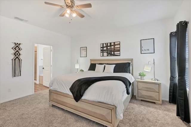 carpeted bedroom featuring ceiling fan and connected bathroom