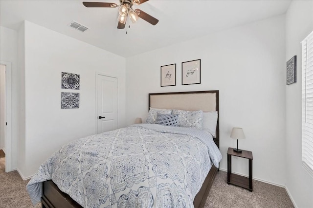 bedroom featuring ceiling fan and light colored carpet