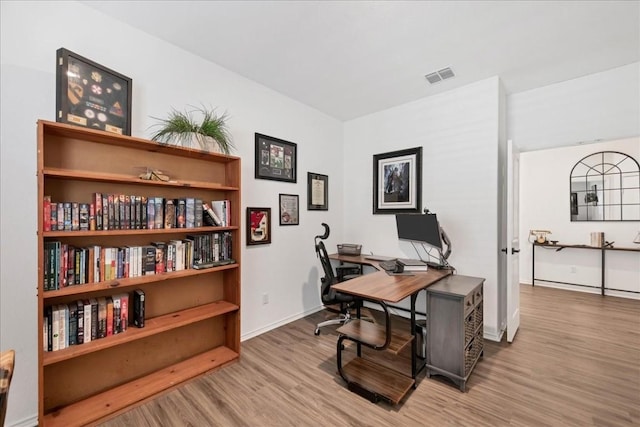 home office with light wood-type flooring