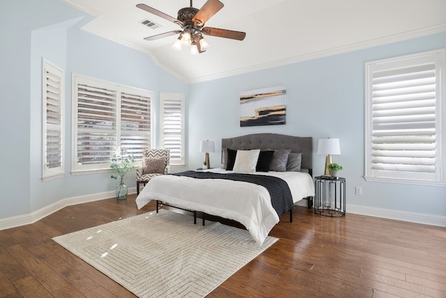 bedroom featuring vaulted ceiling, crown molding, ceiling fan, and dark wood-type flooring