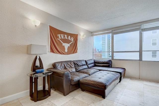 living room with a textured ceiling