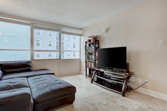 living room with a textured ceiling