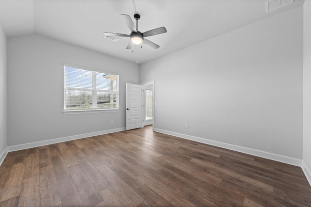 empty room with lofted ceiling, dark wood-type flooring, and ceiling fan