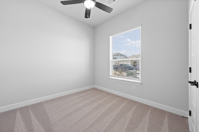 unfurnished room with carpet floors, a healthy amount of sunlight, and ceiling fan