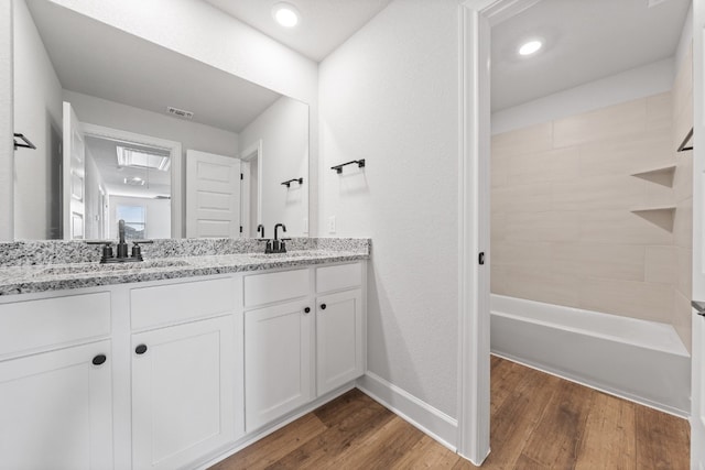 bathroom with wood-type flooring and vanity