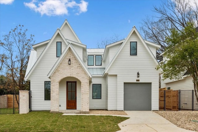 view of front of house with a garage and a front lawn