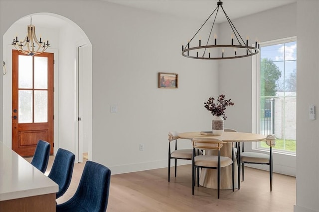 dining room featuring a chandelier and light wood-type flooring