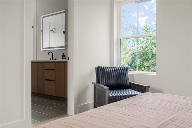 tiled bedroom with sink