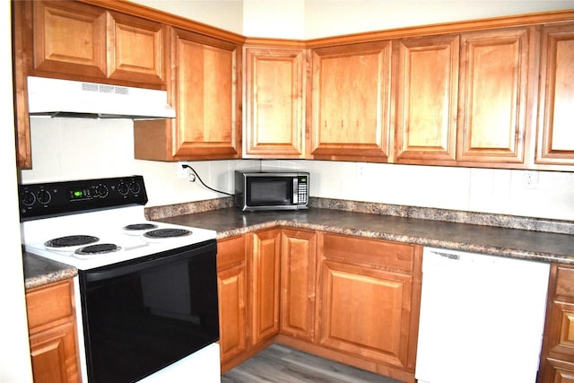 kitchen featuring white appliances and light wood-type flooring