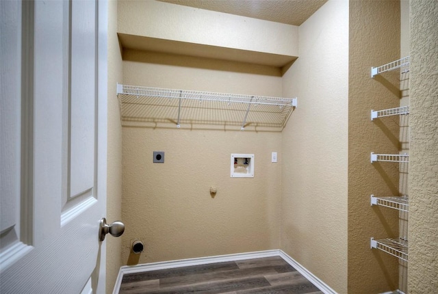 clothes washing area with laundry area, washer hookup, baseboards, dark wood finished floors, and electric dryer hookup