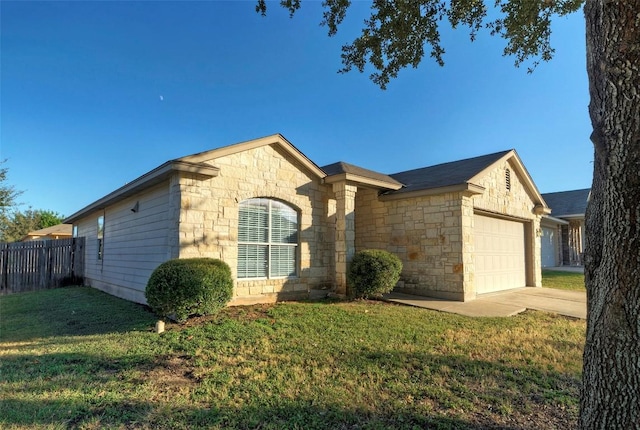 single story home featuring a front lawn and a garage