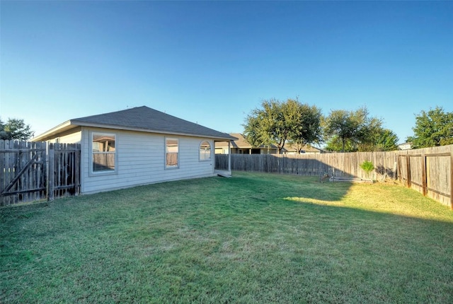 view of yard featuring a fenced backyard