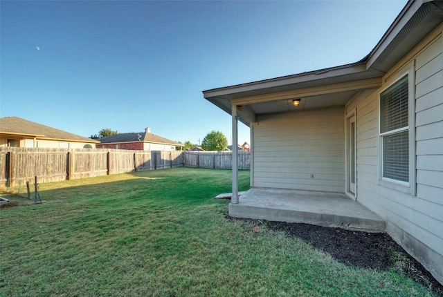 view of yard with a fenced backyard