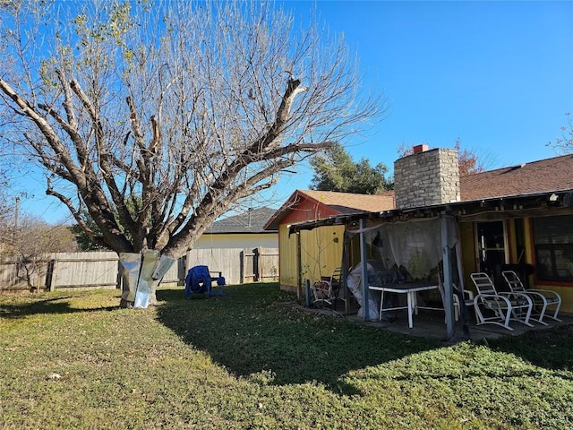 exterior space featuring a lawn and a patio