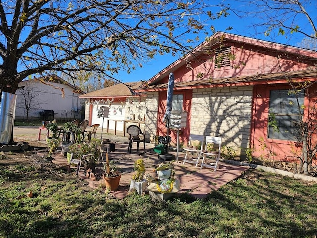 rear view of house featuring a patio