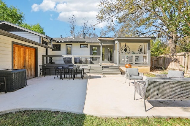 back of house with a patio area and central air condition unit