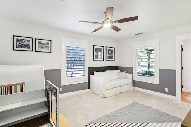 carpeted bedroom with ceiling fan