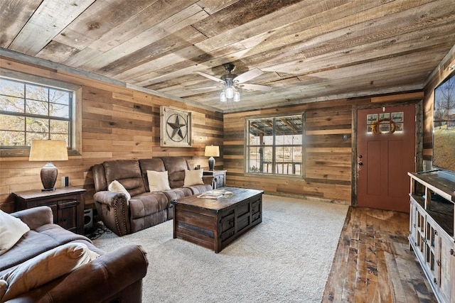 living room featuring hardwood / wood-style floors, ceiling fan, wooden walls, and wood ceiling